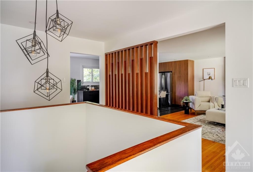 View from Front Door - Open Layout Living Room & Kitchen with Charming Wood Accent Wall!