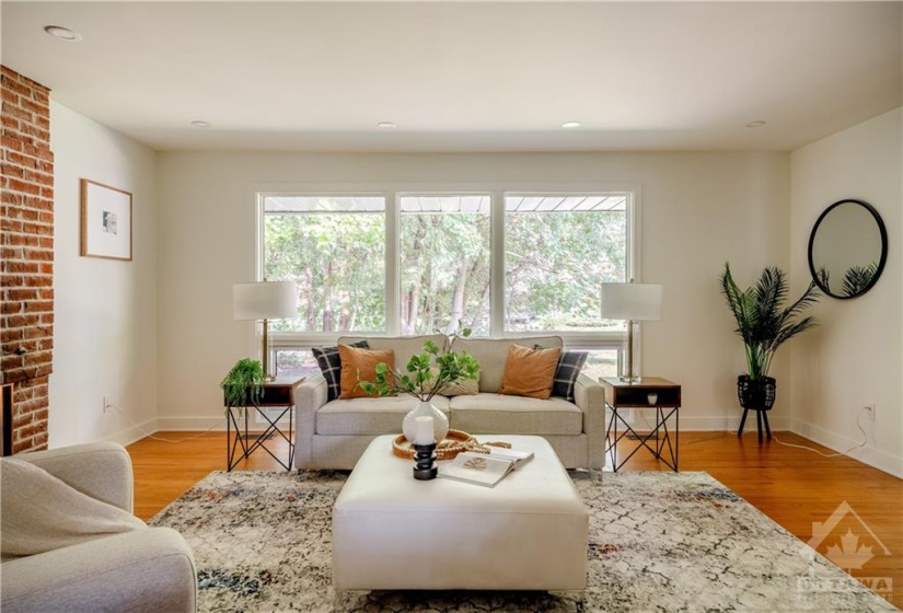 View of Living Room from Kitchen - Large Windows for ample Natural Light