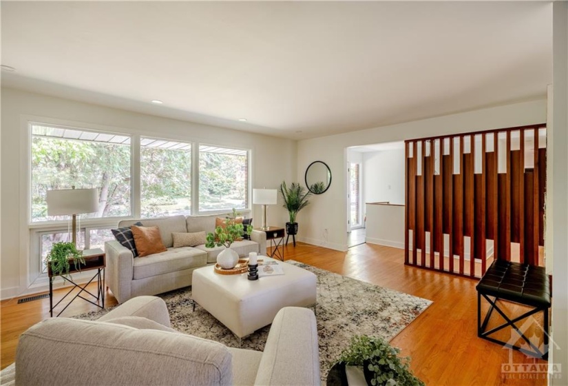 View of Living Room from Corner near Kitchen - Large Living Room, Bright Natural Light, Beautiful Wood Accent Wall