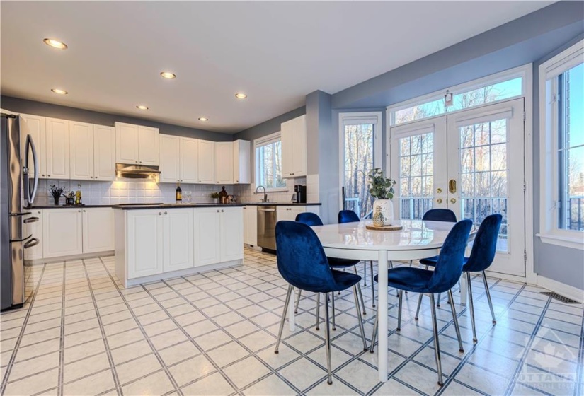 Spacious kitchen & eating area with ample cabinetry