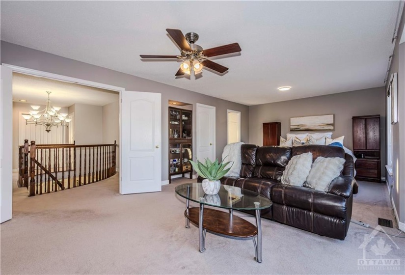 Primary bedroom with 5pc ensuite, closet, and bay windows