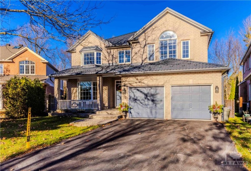 The oversized lot (100 ft across the back) sits on a quiet crescent, great curve appeal with metal roof!