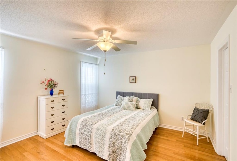 Primary bedroom view w/walk-in closet to right ...