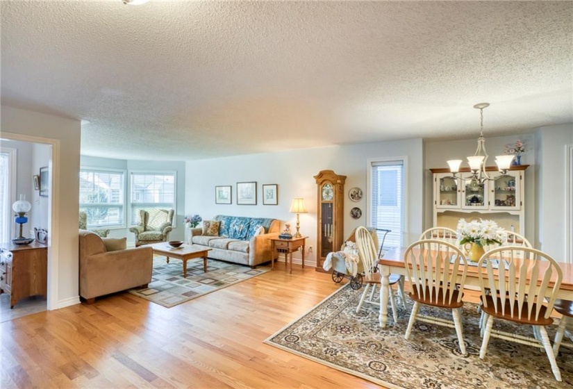 View of foyer, living + dining areas ...