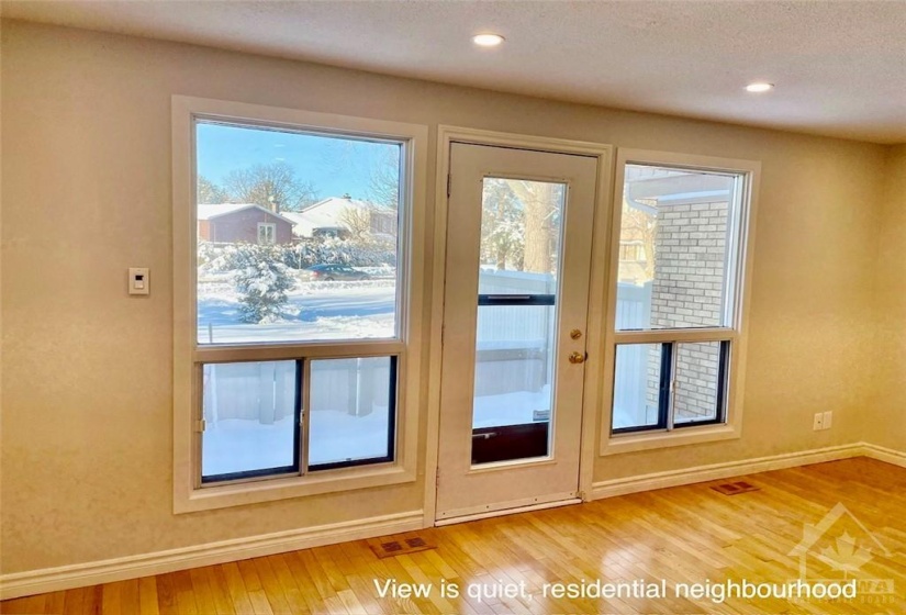 Lots of  windows looking out to the yard and grass beyond.