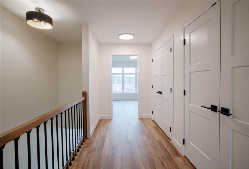 Upstairs Foyer with laundy room and linen closet